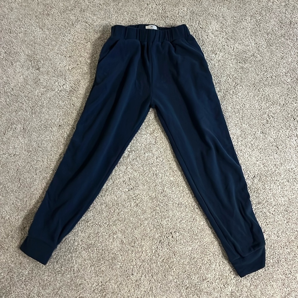 Dudley Stephens navy terry joggers with grosgrain detail on legs and has pockets
